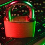 Red padlock on a backlit keyboard representing password security and The Password Game rules