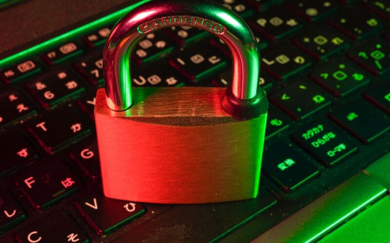 Red padlock on a backlit keyboard representing password security and The Password Game rules
